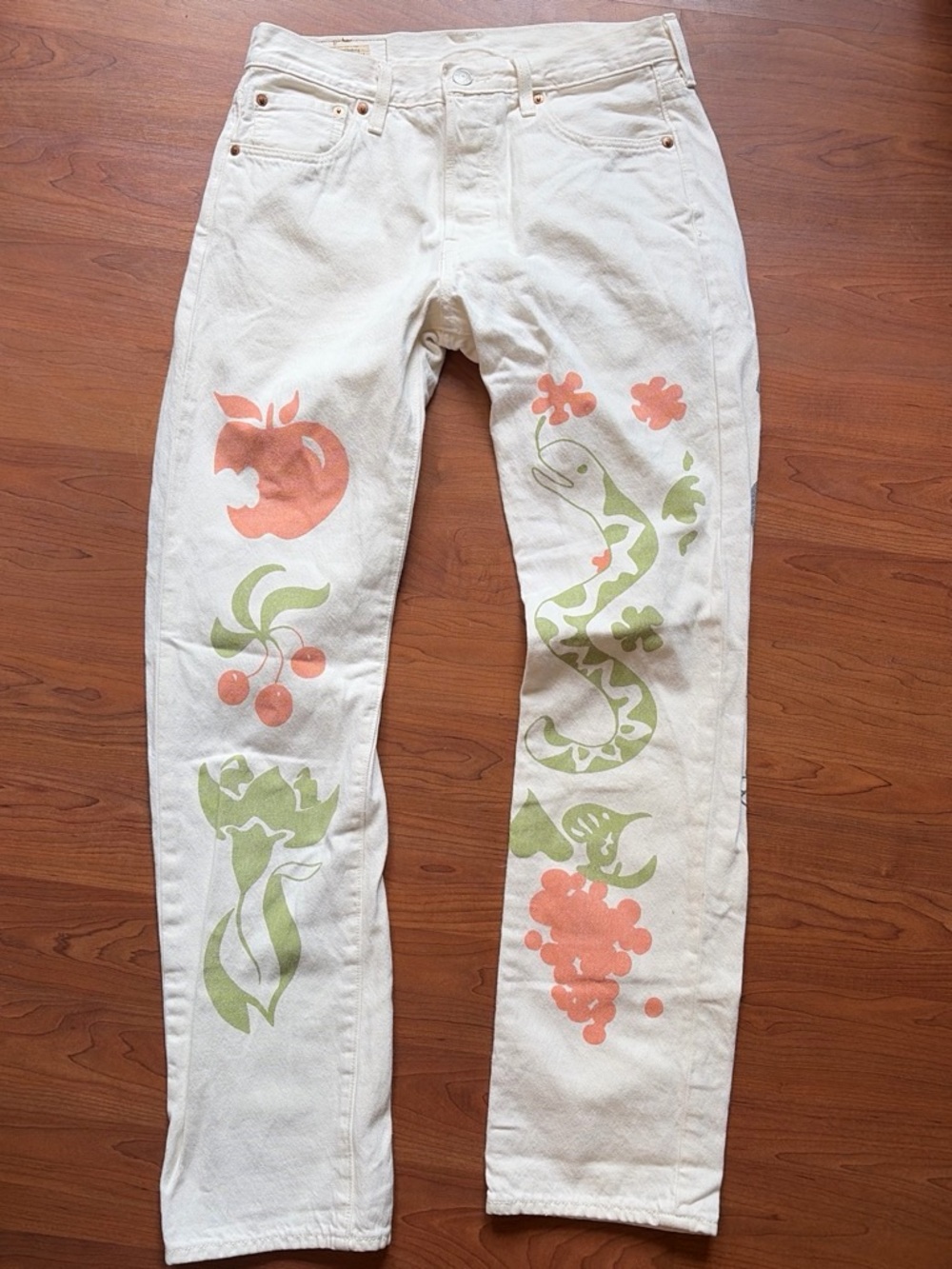 White Graphic Painted Jeans with Green & Peach Motifs from Levi’s
